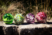 Glass orbs with cremation ash